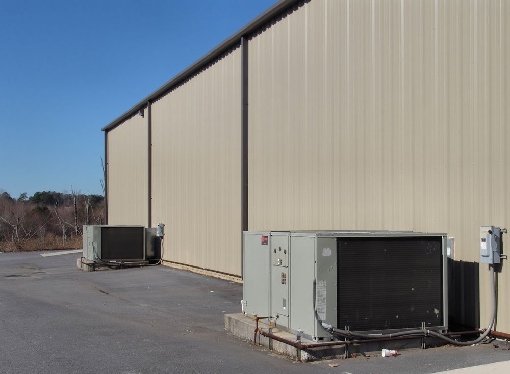 Industrial Building Exterior With Rooftop HVAC Units — Enterprise Air That's Cool In Sharron, QLD