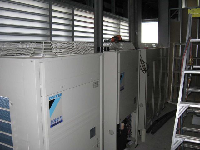 Large Industrial Generator Units in a Metal-walled Room — Enterprise Air That's Cool In Svensson Heights, QLD