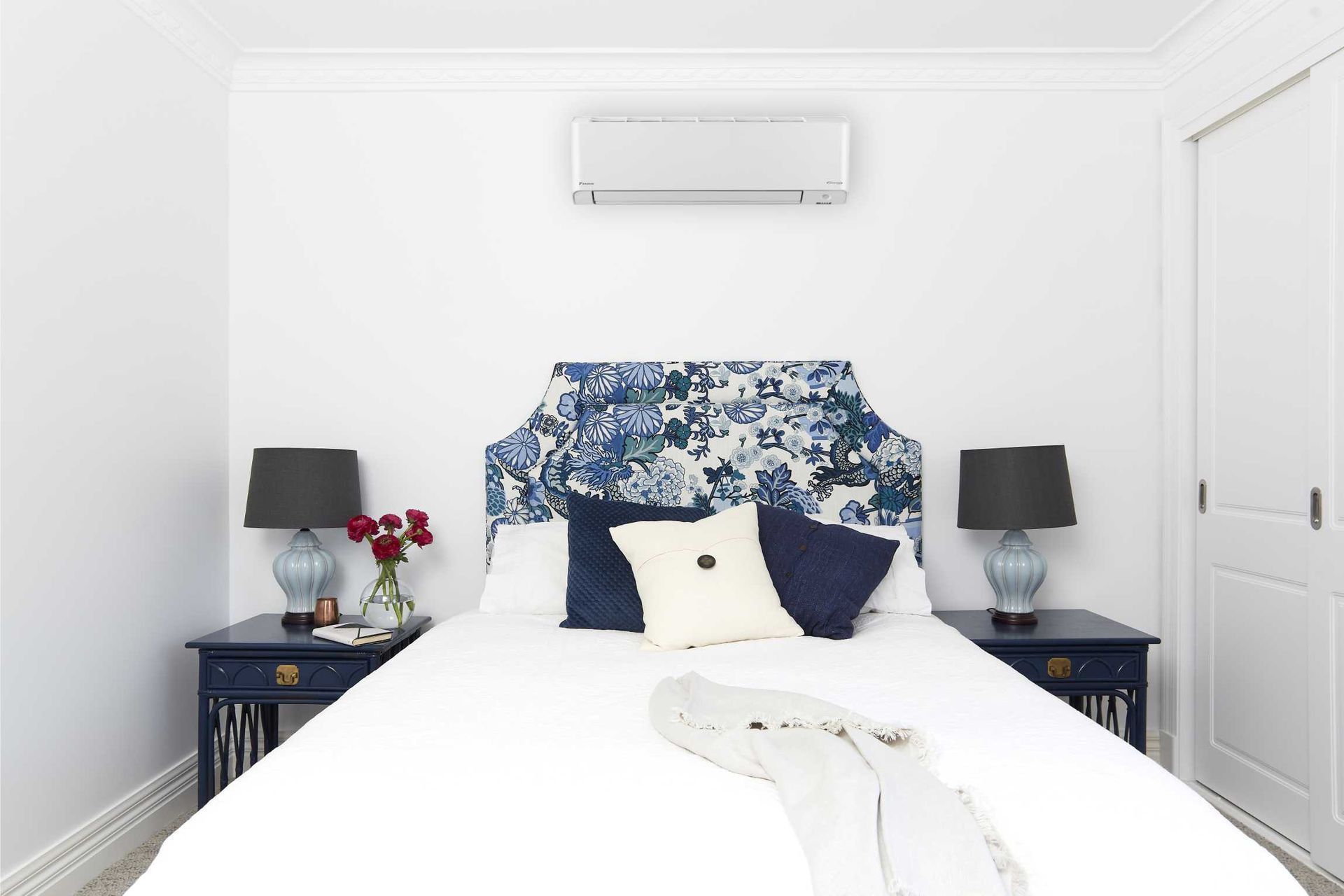 Bright White Bedroom With a Bed — Enterprise Air That's Cool In Svensson Heights, QLD