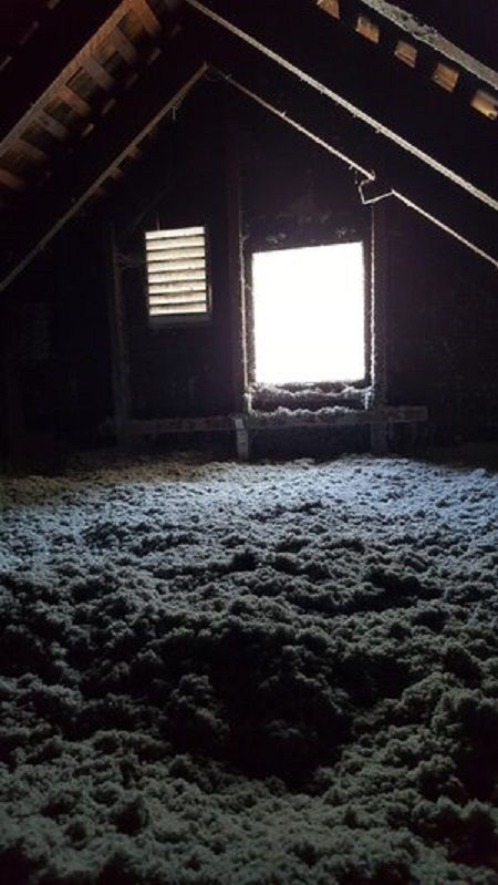 Attic insulated with loose-fill cellulose insulation by Cleveland Home Insulation