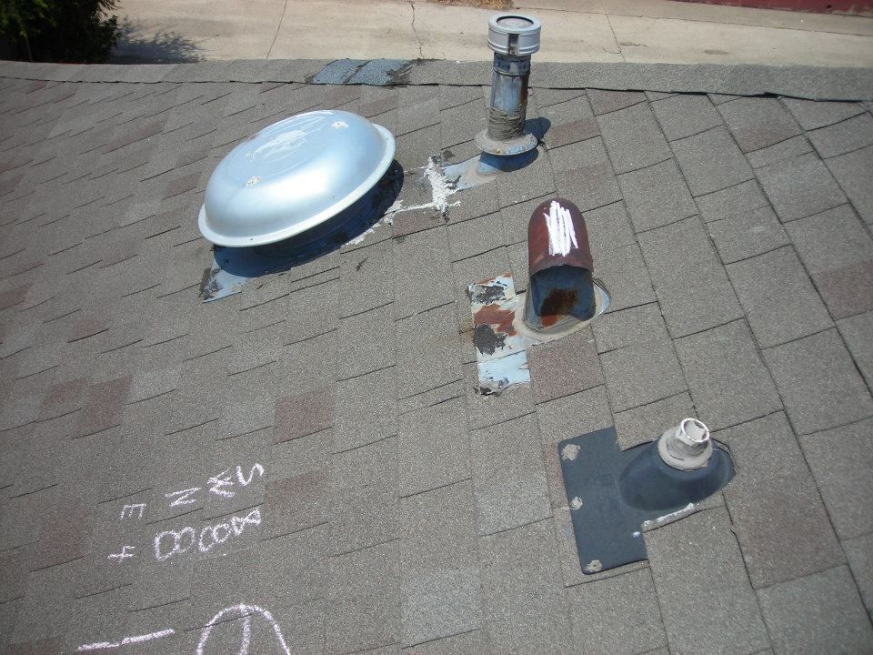 Roof with vents of varying sizes and shapes.