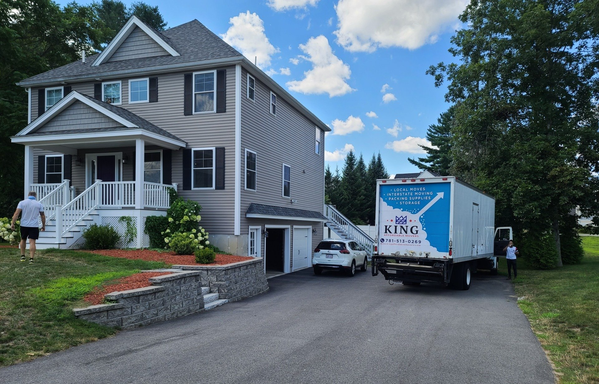 A large house with a white truck parked in front of it