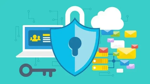 An illustration of a shield with a key in front of a laptop.