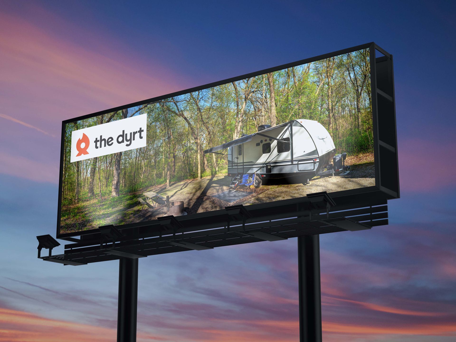 Billboards with cabin advertisement; sunset background.