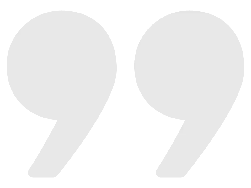 A pair of white quotation marks on a white background.