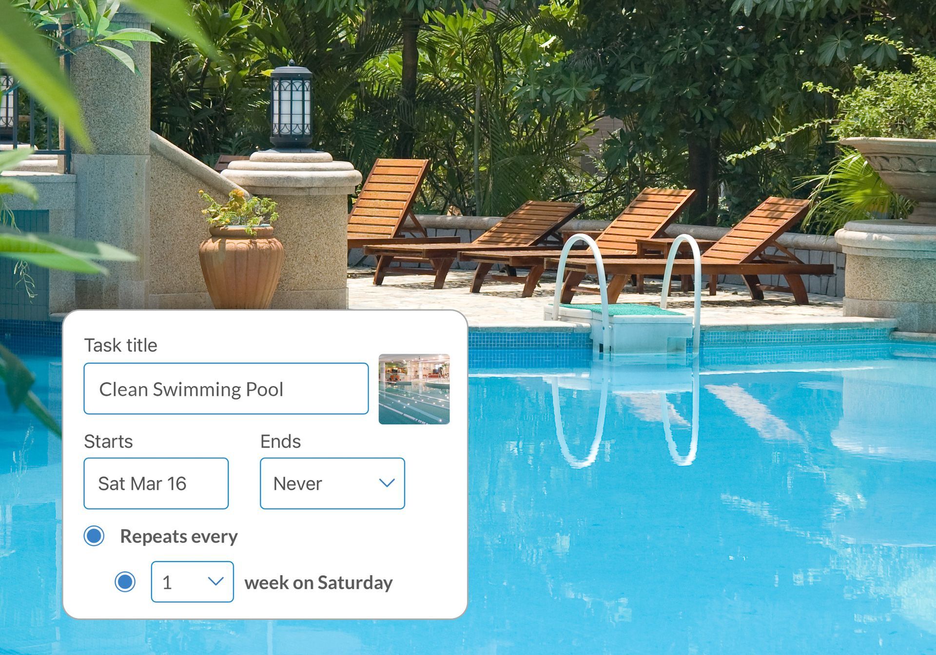 A swimming pool with a ladder and chairs around it
