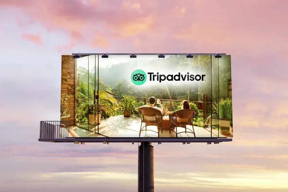 Billboards with cabin advertisement; sunset background.