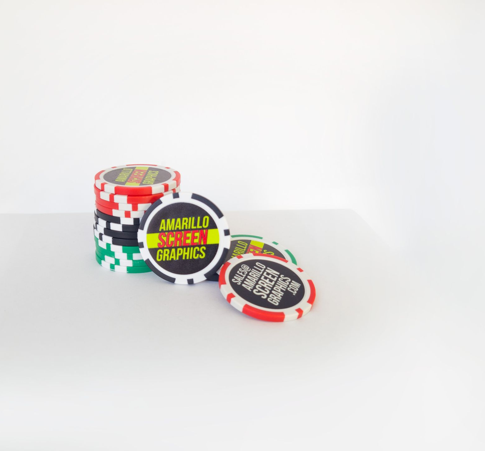 Stack of poker chips with Amarillo Screen Graphics Logo