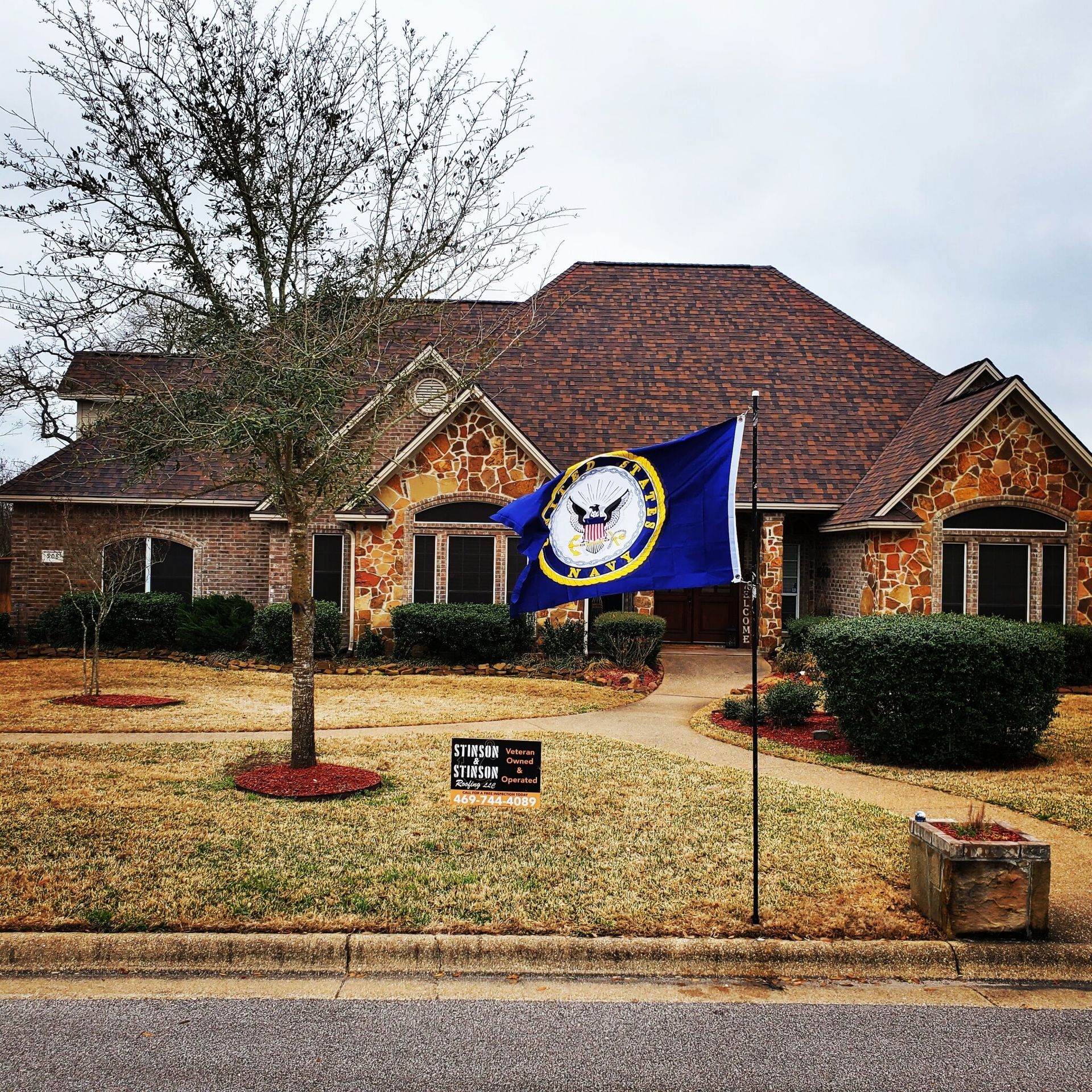 A house with a blue flag in front of it