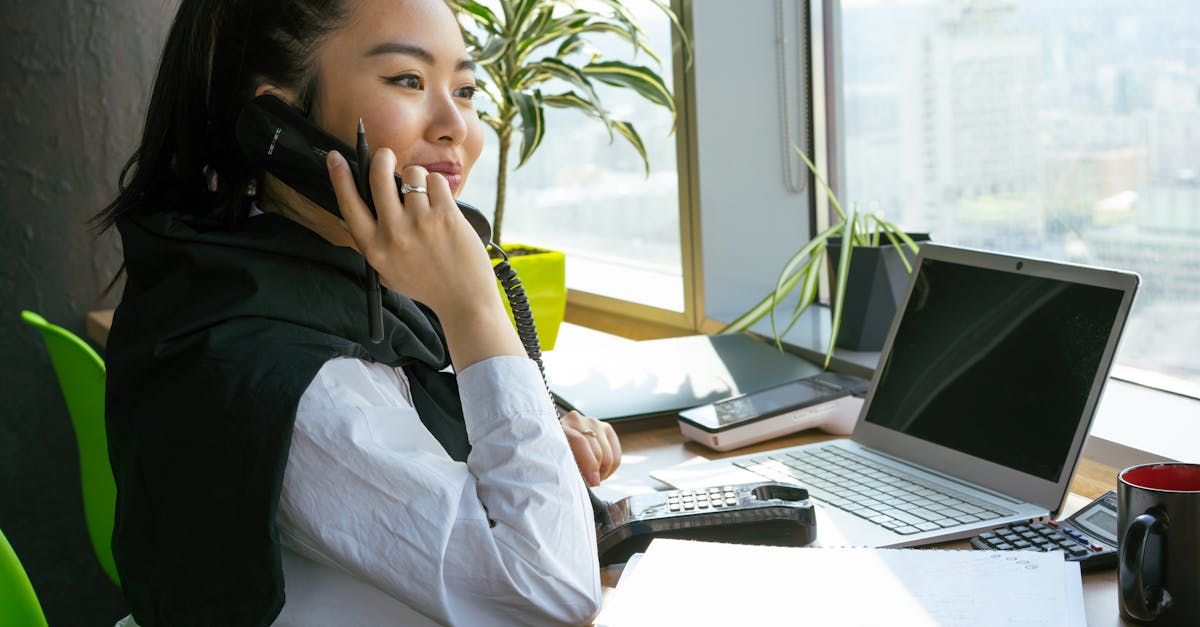 A kitchen with white cabinets, stainless steel appliances, a refrigerator, and a stove.