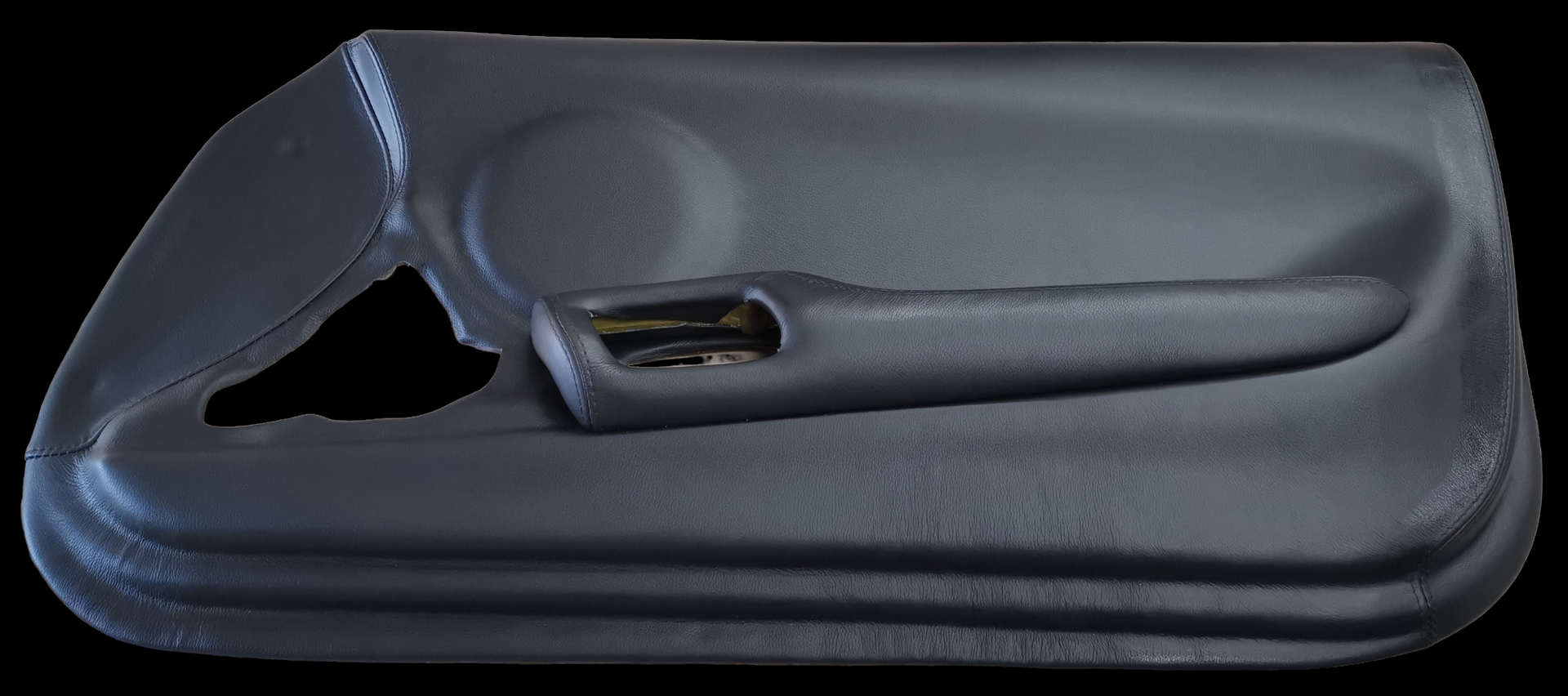 Dark gray car door panel with speaker and door handle.
