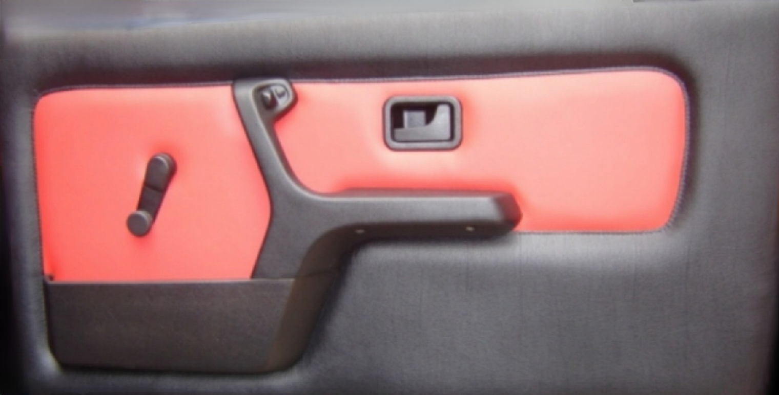 Car door panel with red insert and black trim, handle, and crank.