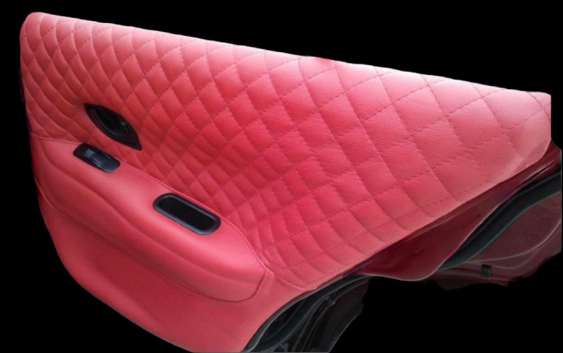 Red quilted car door panel with black controls.