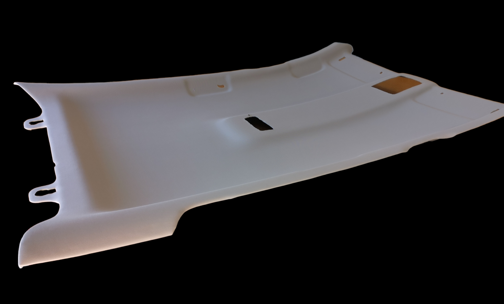White car interior panel with cutouts for mounting.