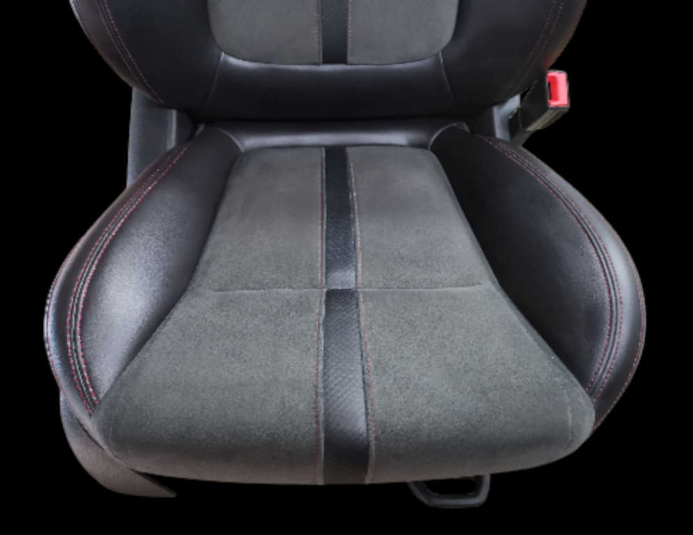 Black and gray car seat with red stitching details and a center stripe, against a black background.
