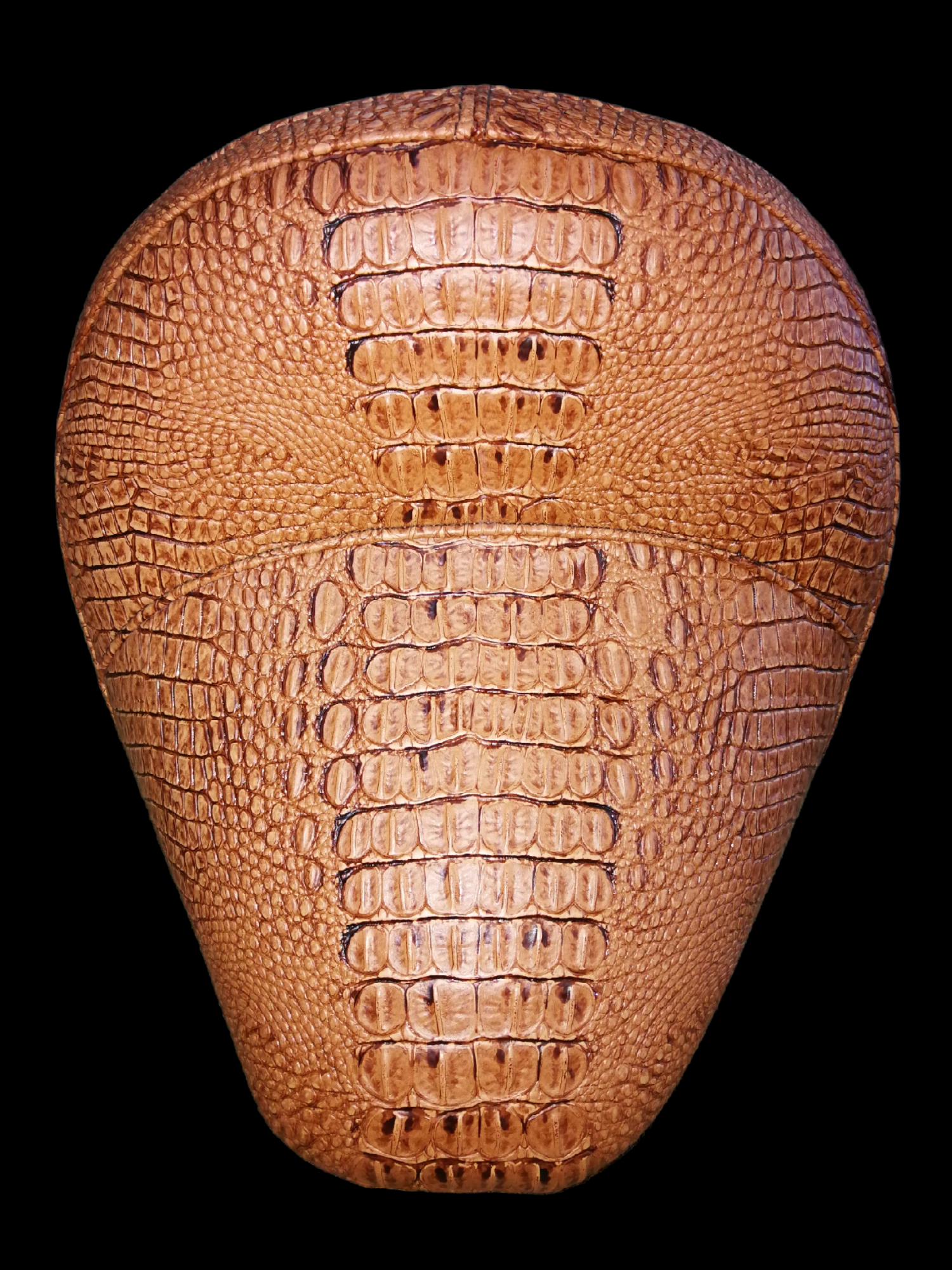 Brown, textured football, possibly leather or faux, on a black background.
