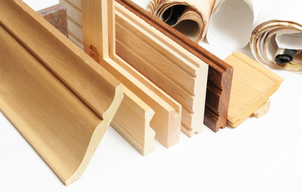 Various wood trim samples, different colors and styles, against a white background.