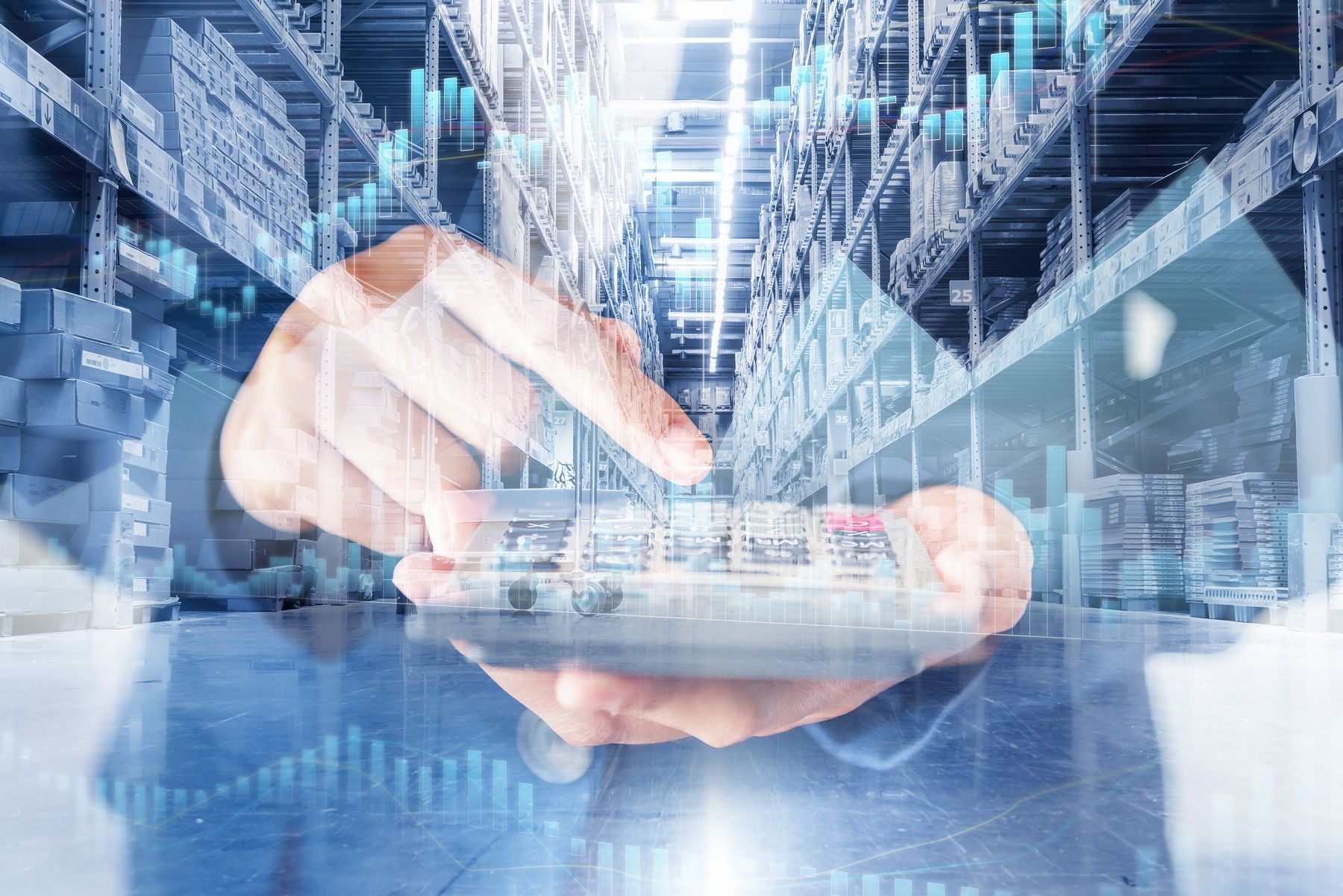 Person using a tablet overlaid with a warehouse and data charts.