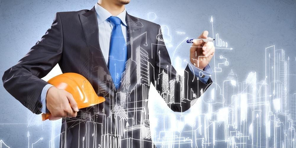 Architect in suit, drawing building design with pen, holding orange hard hat.
