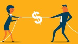 Woman and man tug-of-war over a dollar sign on a rope; both have strained expressions.