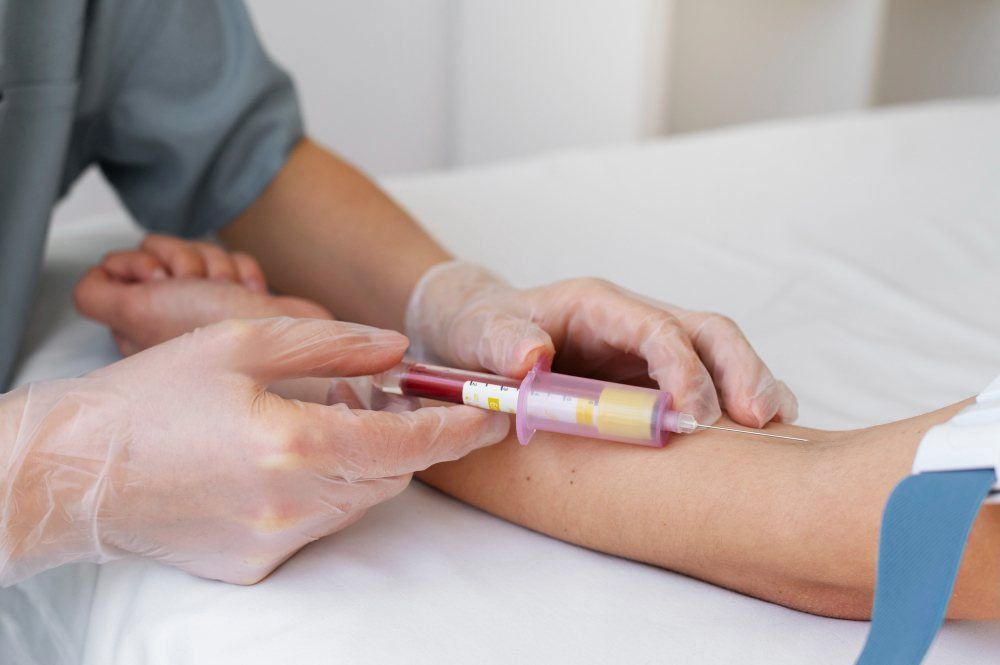 someone getting blood taken for a lab test at home