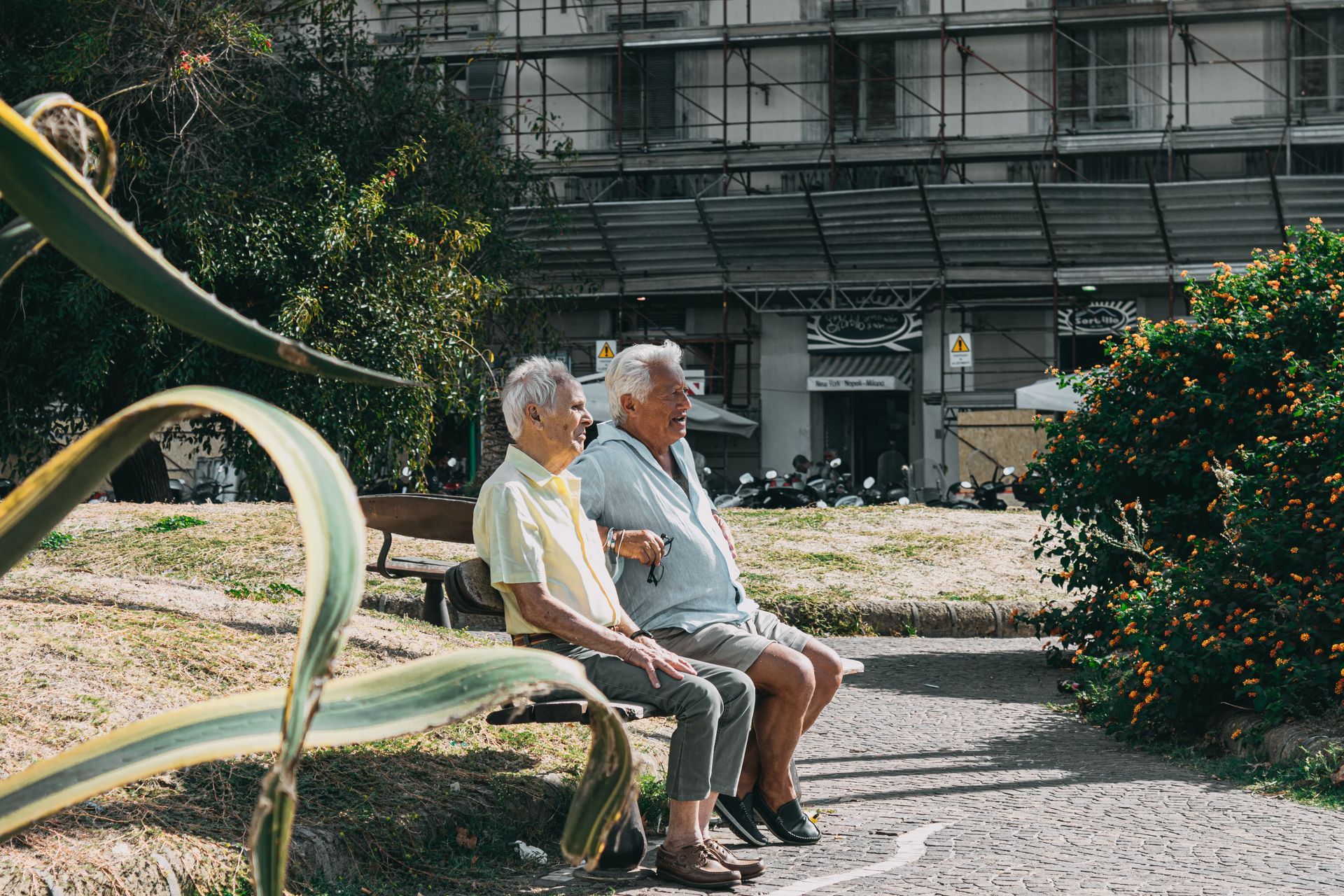 A person wearing blue gloves is examining another person 's foot.