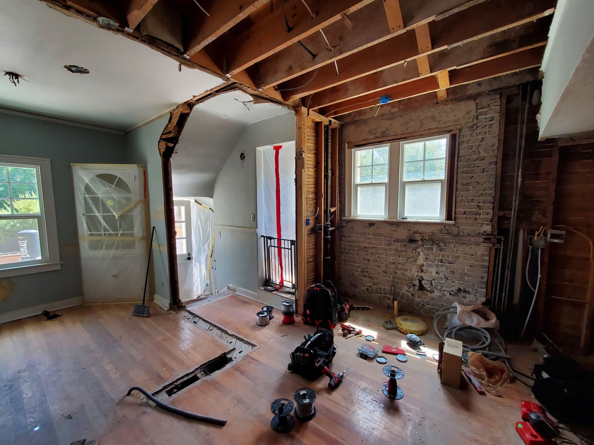 A room that is being remodeled with a lot of tools on the floor.