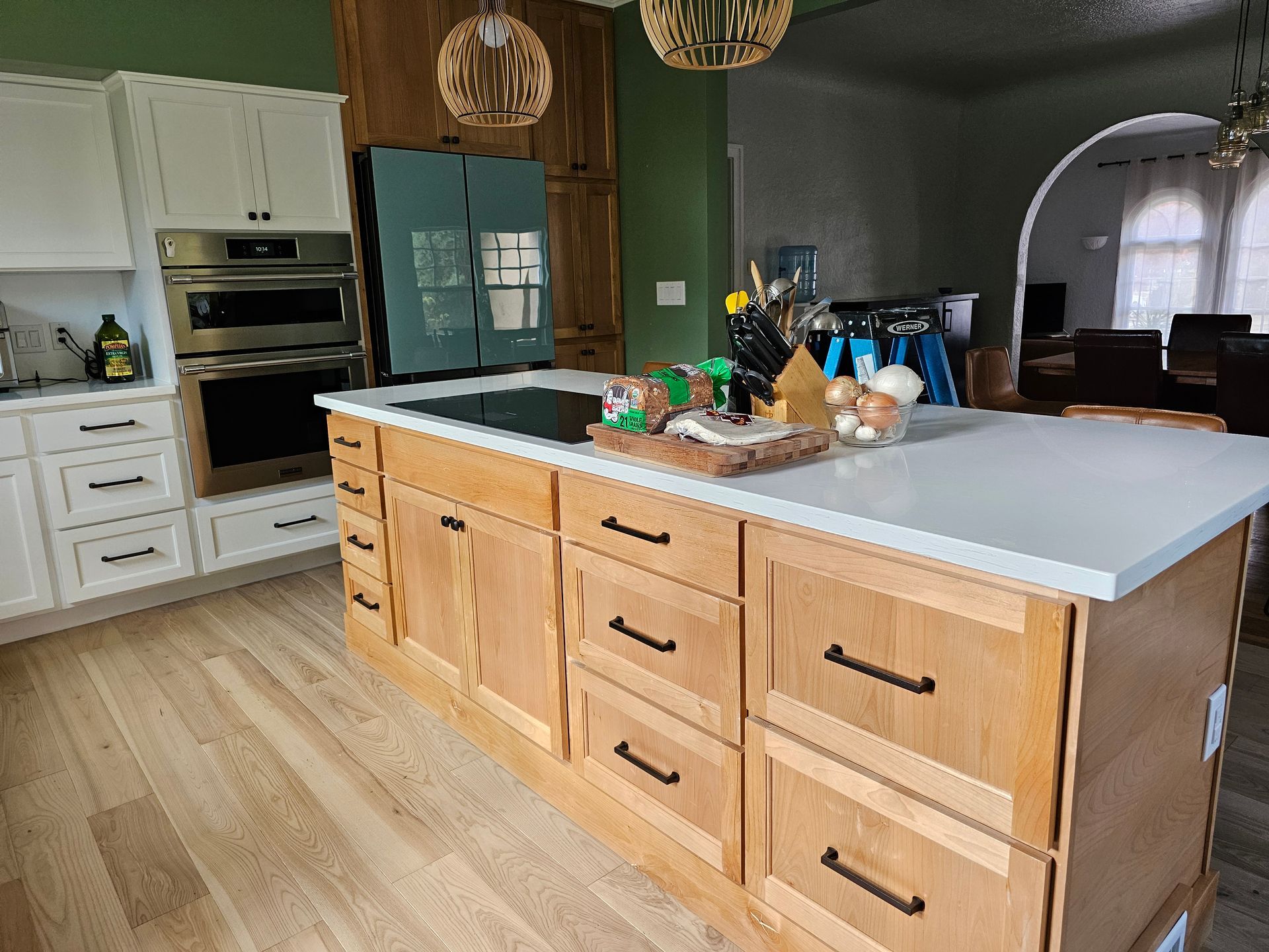 A kitchen with a large island in the middle of it.