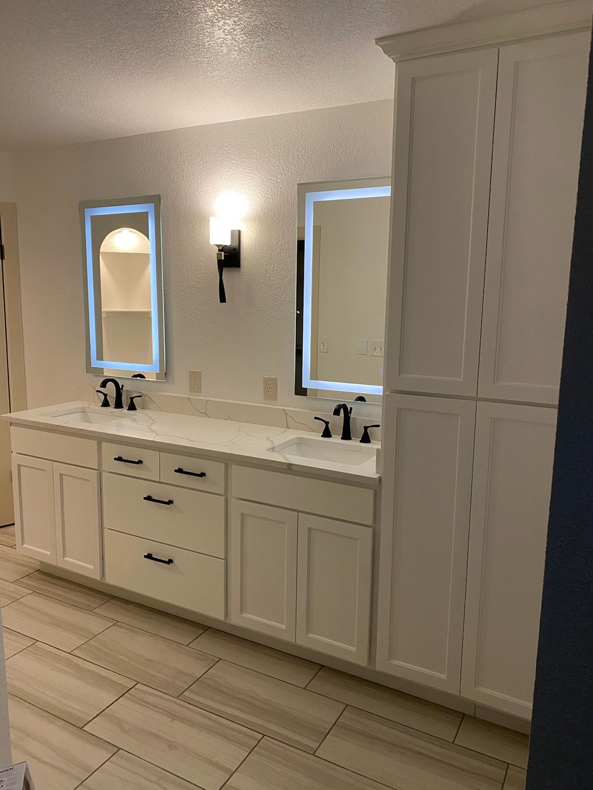 A bathroom with two sinks and two mirrors.