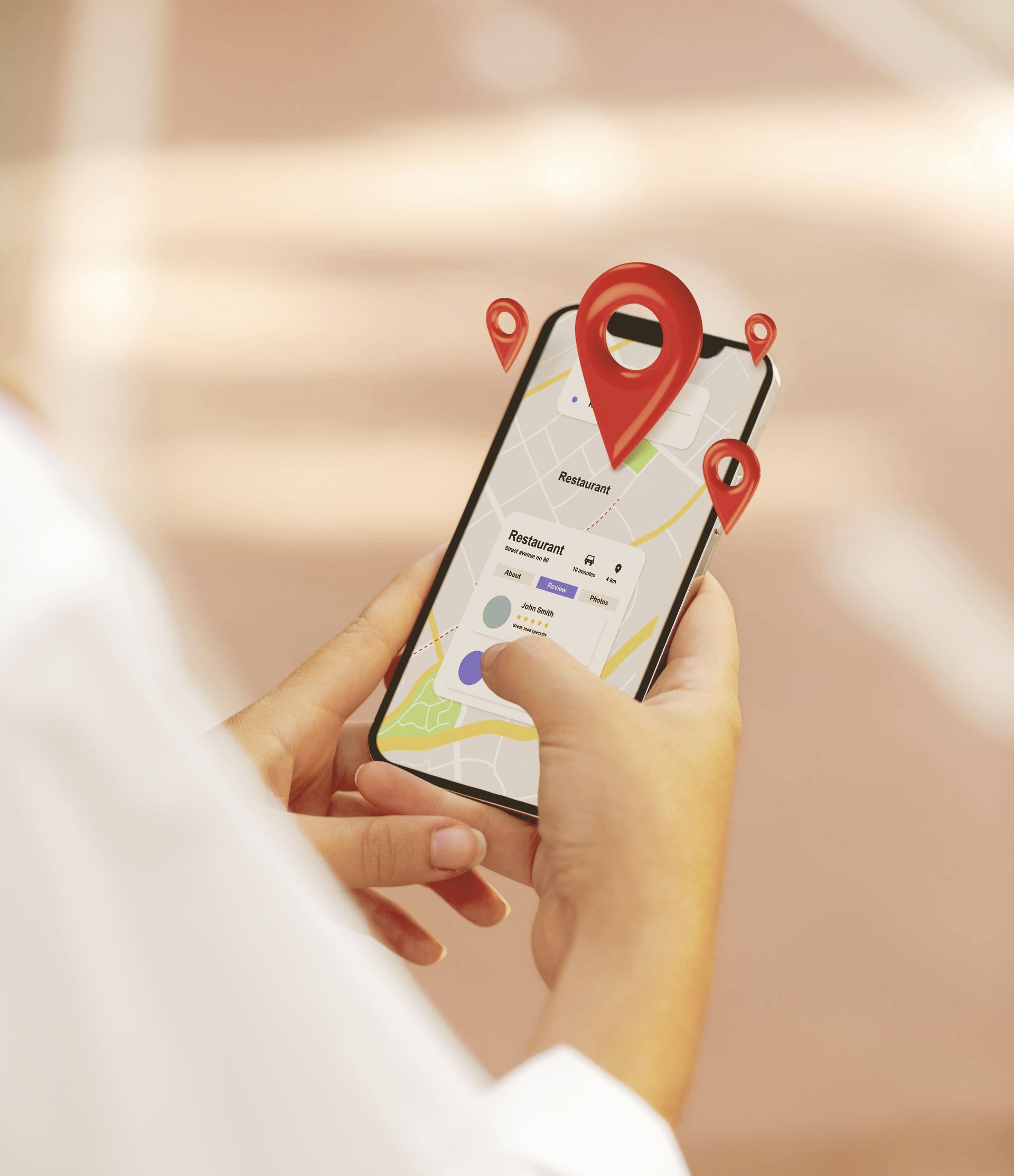 A person is holding a cell phone with a map on it.
