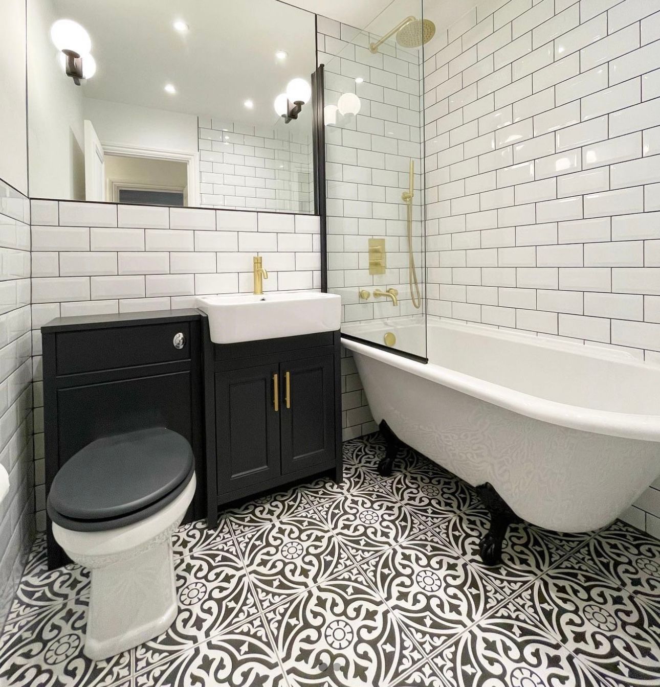 A bathroom with a toilet a sink and a bathtub