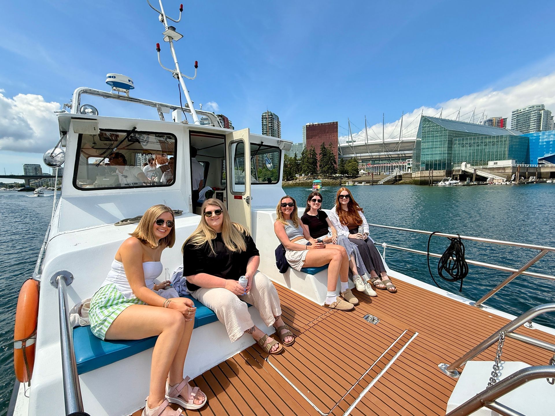 Passengers enjoying a sightseeing boat tour in Vancouver