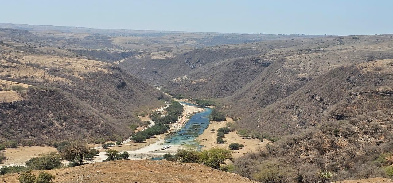 Wadi Darbat in the southern Omani region of Dhofar outside the monsoon season called Khareef - dry and brown