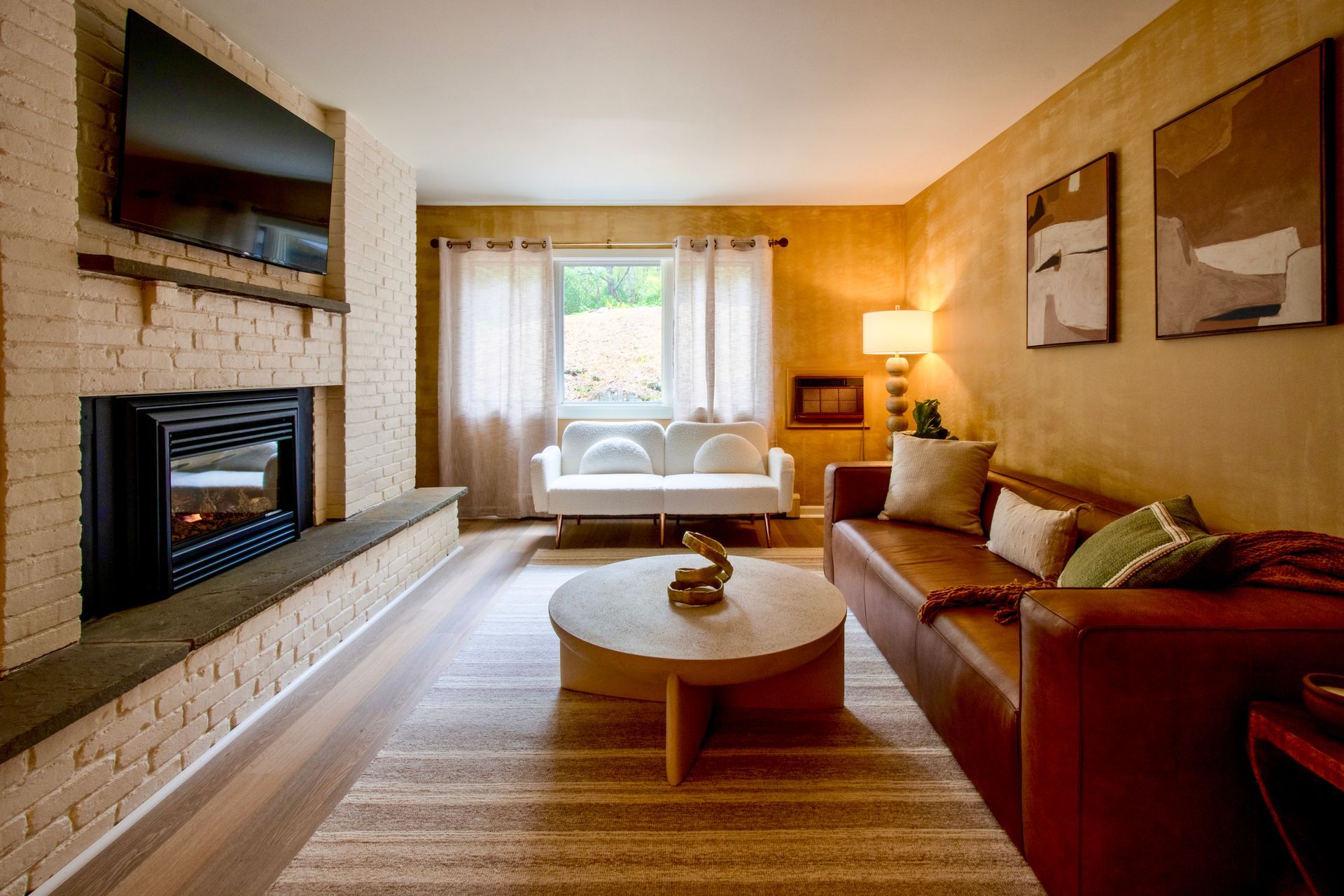 A living room with a couch and a fireplace