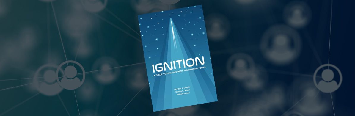 Blue “Ignition” booklet centered on a dark, digital-themed background with faint connected user icons.