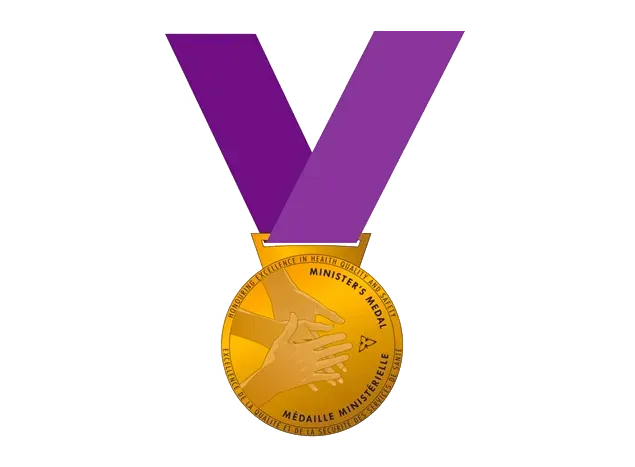 Gold medal with a purple ribbon on a white background