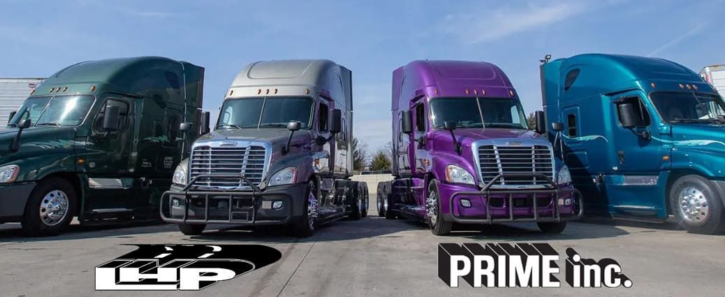 Three semi trucks are parked next to each other on a road.