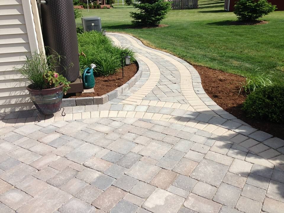 A brick walkway, custom patio and driveway service.