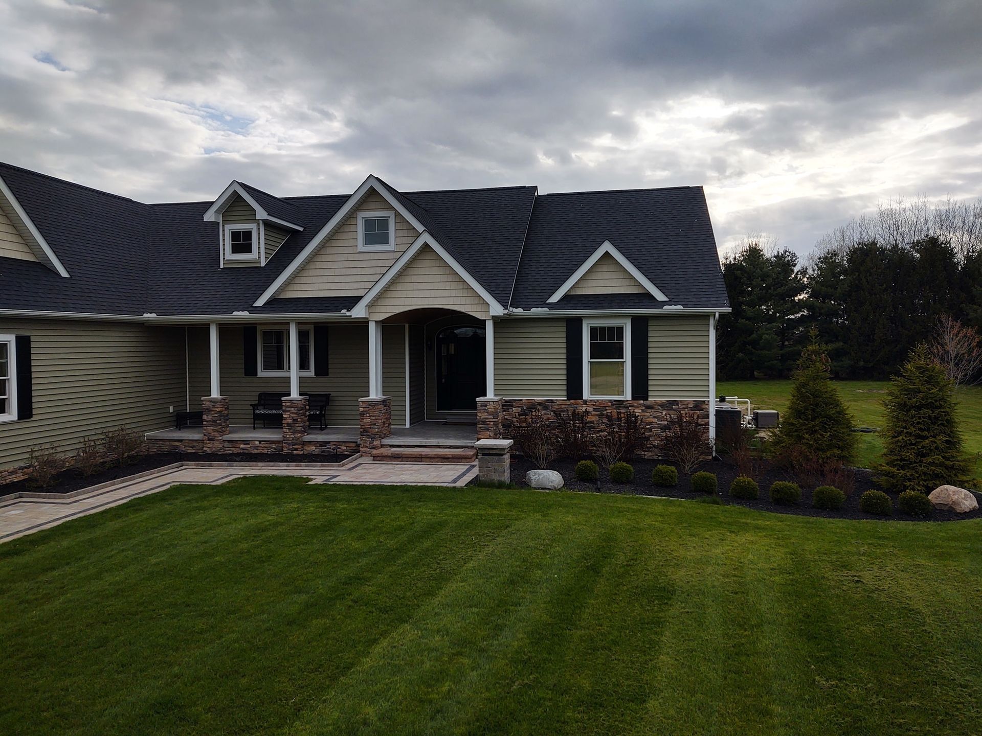 A large house with a large lawn in front of it