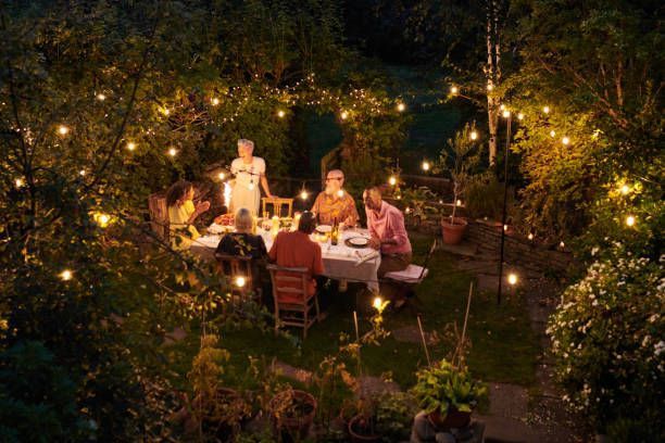 A family eating dinner outside the house