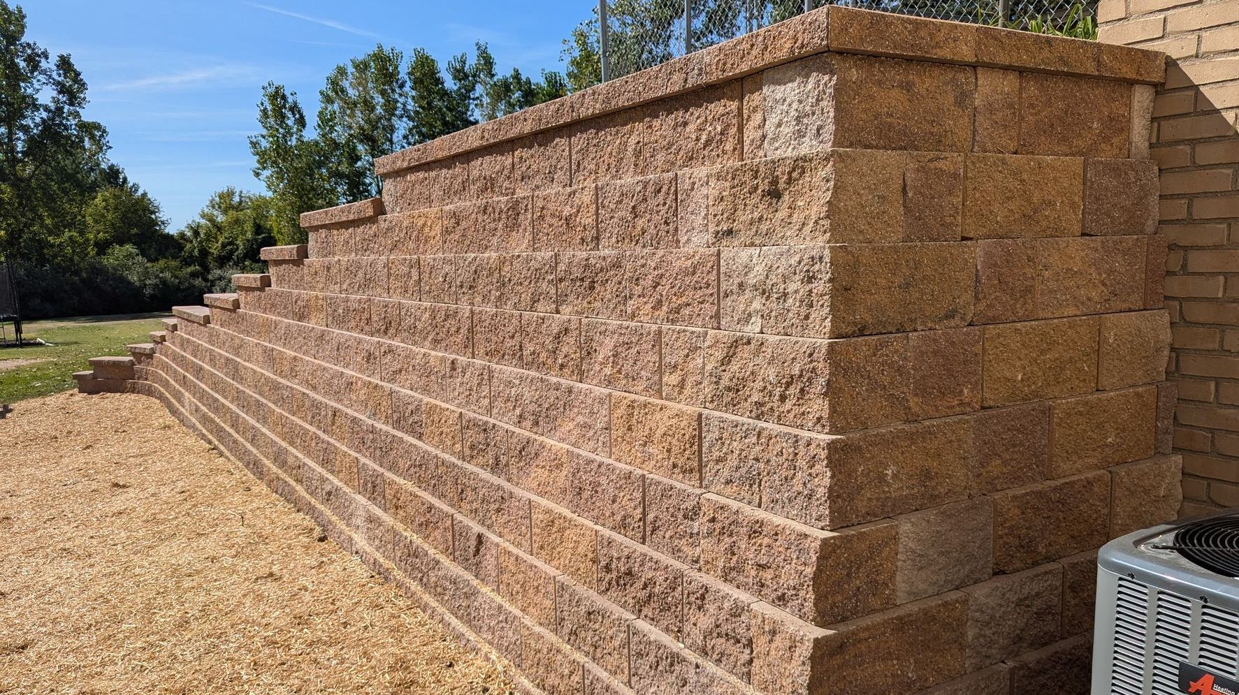 A roll of sod is sitting on top of a pile of dirt. A roll of sod is sitting on top of a pile of dirt.