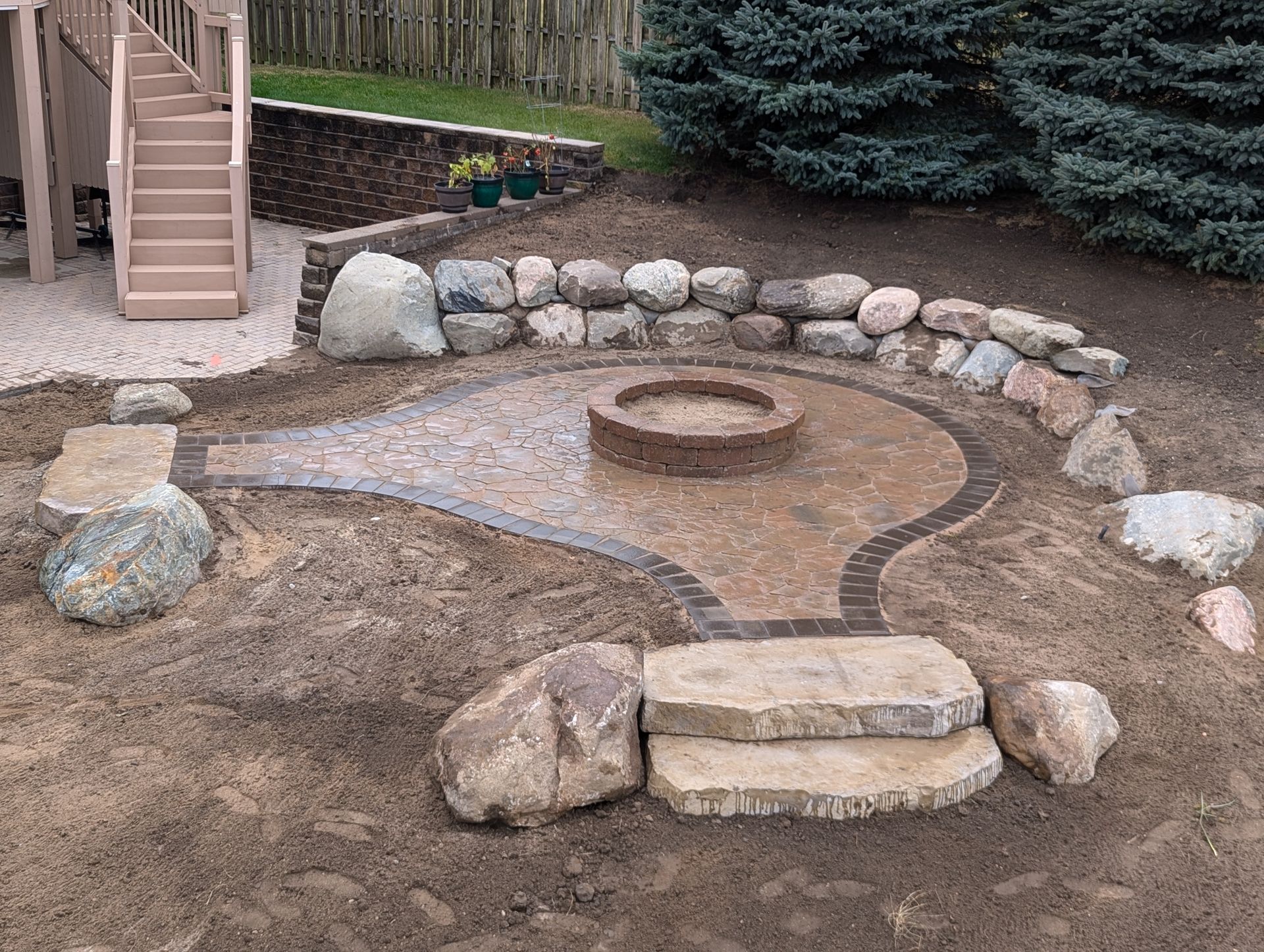 A large pile of rocks sitting on top of a concrete surface.