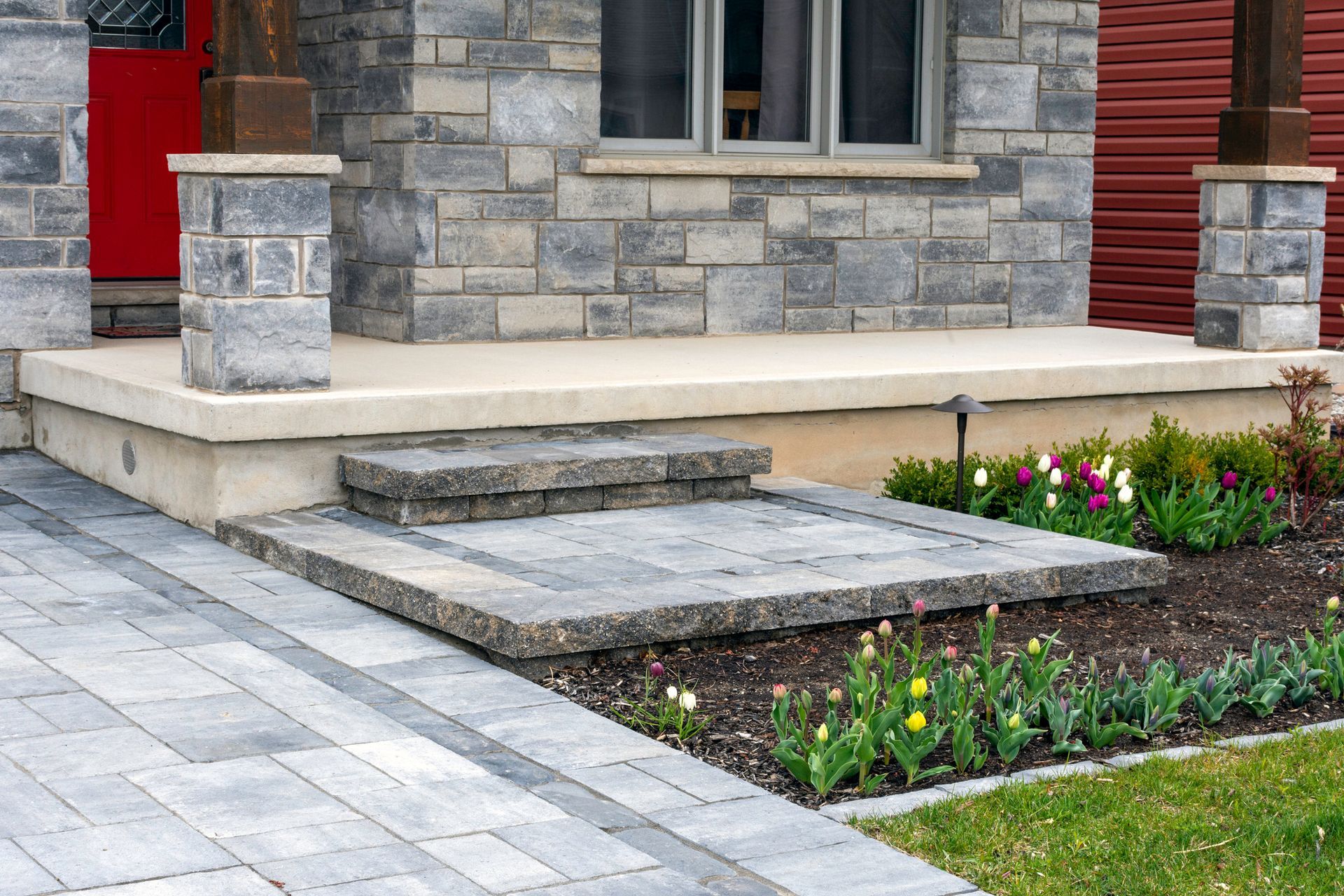 Close-up of luxury small home front yard showcasing landscaping contractor expertise and design.