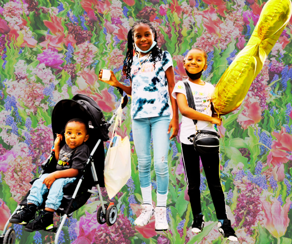 Three children smiling at the camera