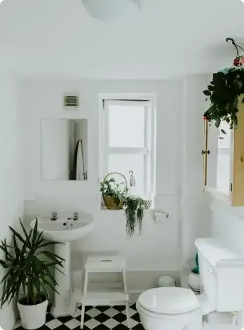 A modern bathroom featuring a freestanding tub and a glass-enclosed shower with bold, black-and-white marble-style tiling. A modern bathroom featuring a freestanding tub and a glass-enclosed shower with bold, black-and-white marble-style tiling.