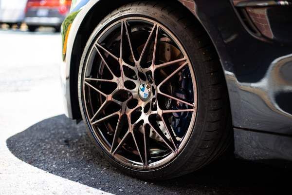 A close up of a car wheel with a bmw logo on it