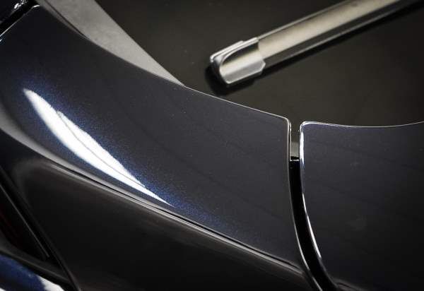 A close up of a car with a wiper blade on it