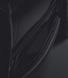 A close up of a bicycle tire on a black background.