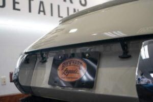 A close up of the back of a car with a license plate.