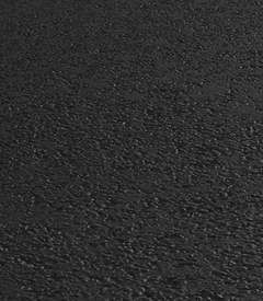 A close up of a black carpet texture.